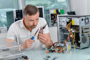 Technician fixing computer